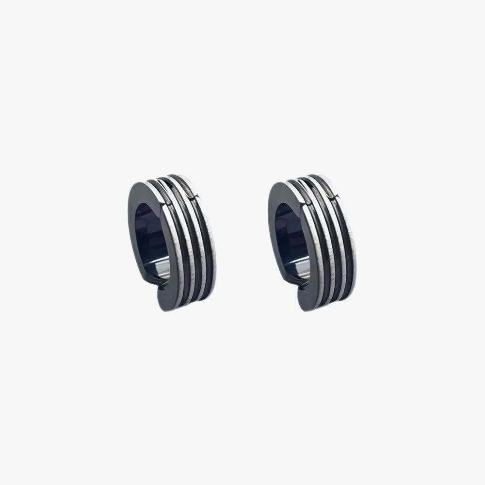 Close-up of men clips earrings in black-plated titanium finish