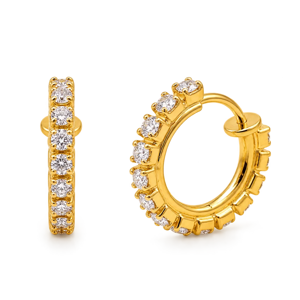 A pair of gold huggie hoop earrings adorned with round-cut clear gemstones, shown from both front and side angles on a plain white background.