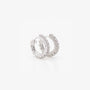 Diamond clip-on silver hoop earrings top view on white background showcasing sparkly round design