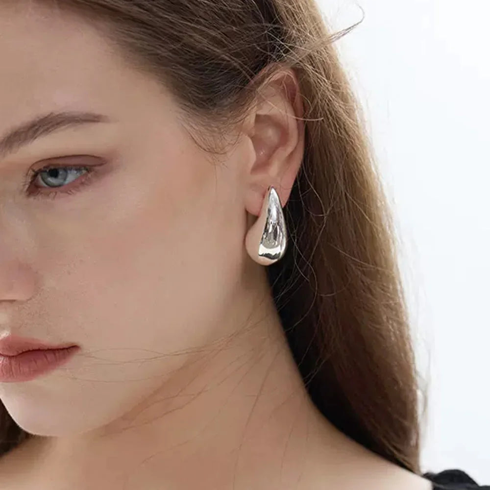 Model wearing the Teardrop Clip-On Earrings in Silver, demonstrating the secure fit and stylish appearance.