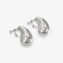 Silver teardrop clip-on earrings displayed at angle on white background showing polished finish and closure detail