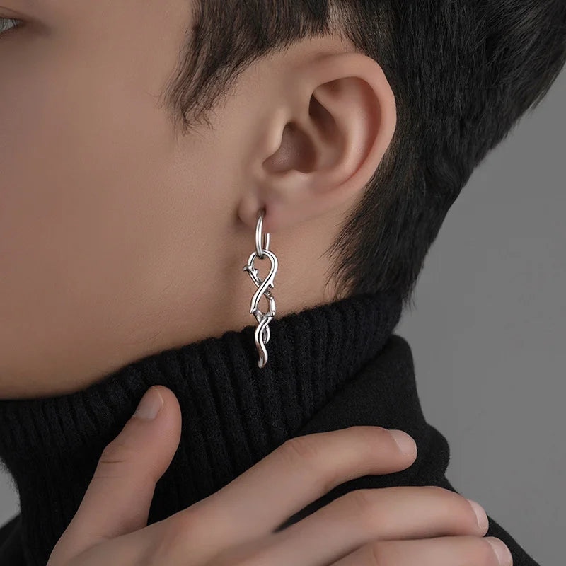 Silver thorn vine clip-on hoop earrings side view worn on model with black turtleneck