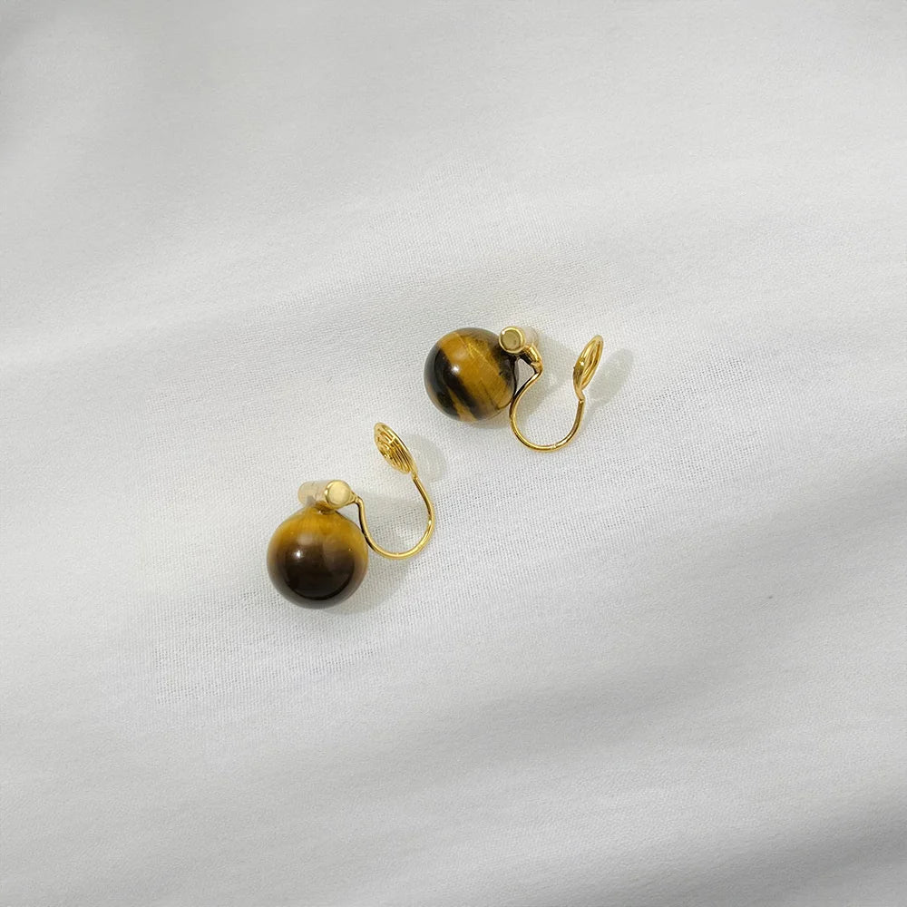 Tiger's Eye Clip On Earrings gold curved wire back view on white background