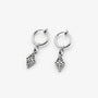 A pair of silver clip on hoop earrings with dangling filigree diamond charms, shown on a clean light gray background.