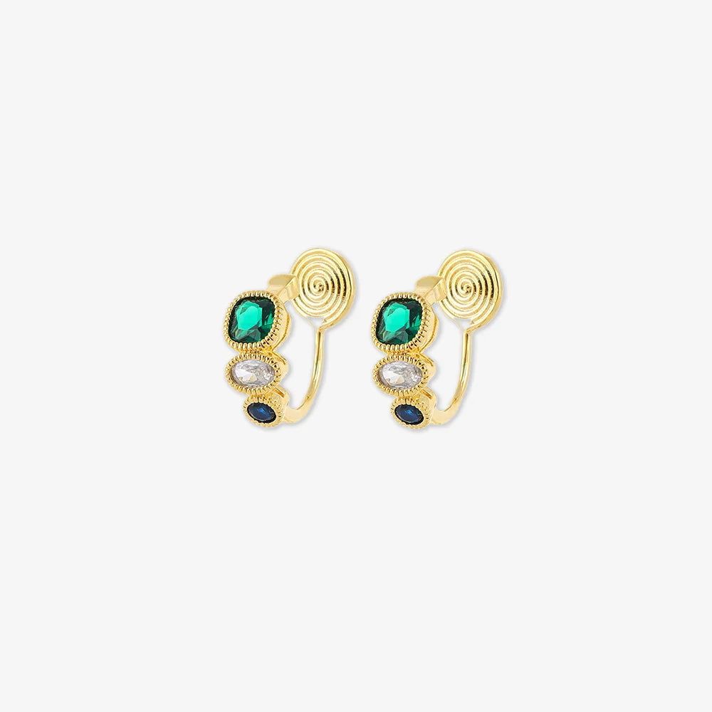 These Triple Color Zircon Emerald Clip-On Earrings feature emerald green, sapphire blue, and clear white zircon stones for a striking look.