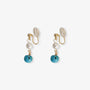 Turquoise clip on pearl earrings with gold hardware front view on white background