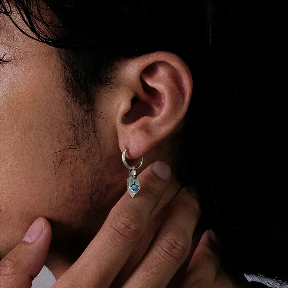 Model wearing Turquoise Sun Sterling Silver Clip-On Hoop Earrings
