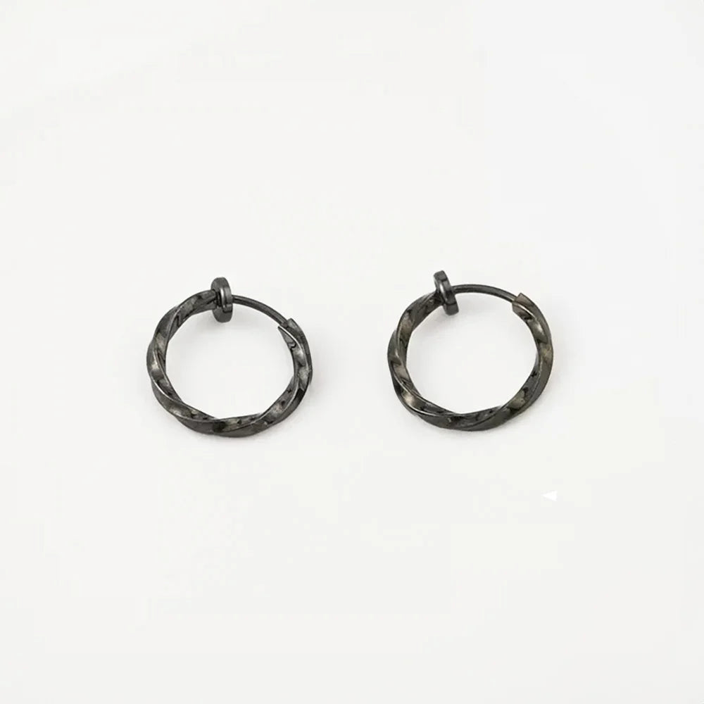 Gunmetal black Twisted Huggie Clip On Hoop Earrings highlighting their sleek and modern appeal.