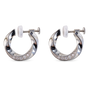 A pair of silver-toned hoop earrings with a twisted design, featuring a row of small clear crystals along the lower curve and white post backings, shown on a plain white background.