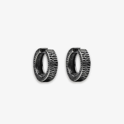 Titanium steel Vintage Tyre Black Clip-On Earrings with a hinged-back design, offering a punk look for men. The rugged texture mimics a tire's surface, perfect for daily wear and adding an edgy touch to any outfit. Ideal for those who appreciate industrial-inspired men's fashion accessories.