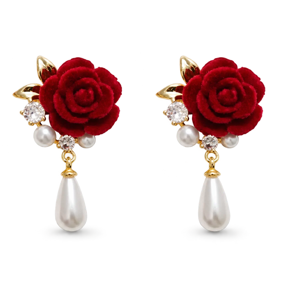 A pair of red rose drop earrings with gold-tone metal, faux pearls, and clear rhinestones on a plain white background.
