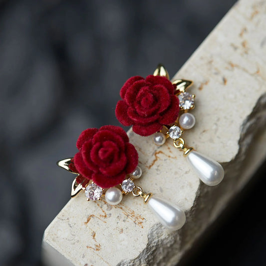 Luxurious clip-on drop earrings for bridal occasions, featuring velvet roses and elegant gold-plated details.