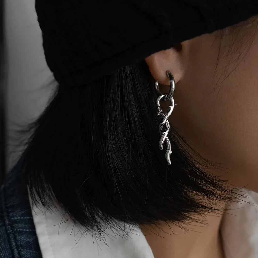 Thorn Vine Clip-On Hoop Earrings silver side view worn on ear with black hair
