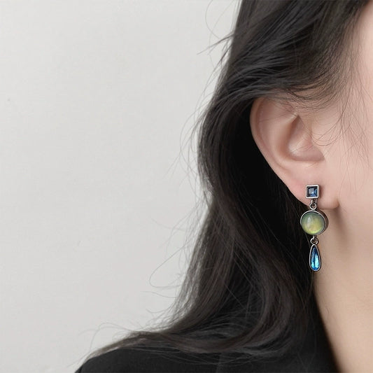 Vintage Multi-Gem Drop Clip-On Earrings worn by a model, highlighting their elegant dangling style.