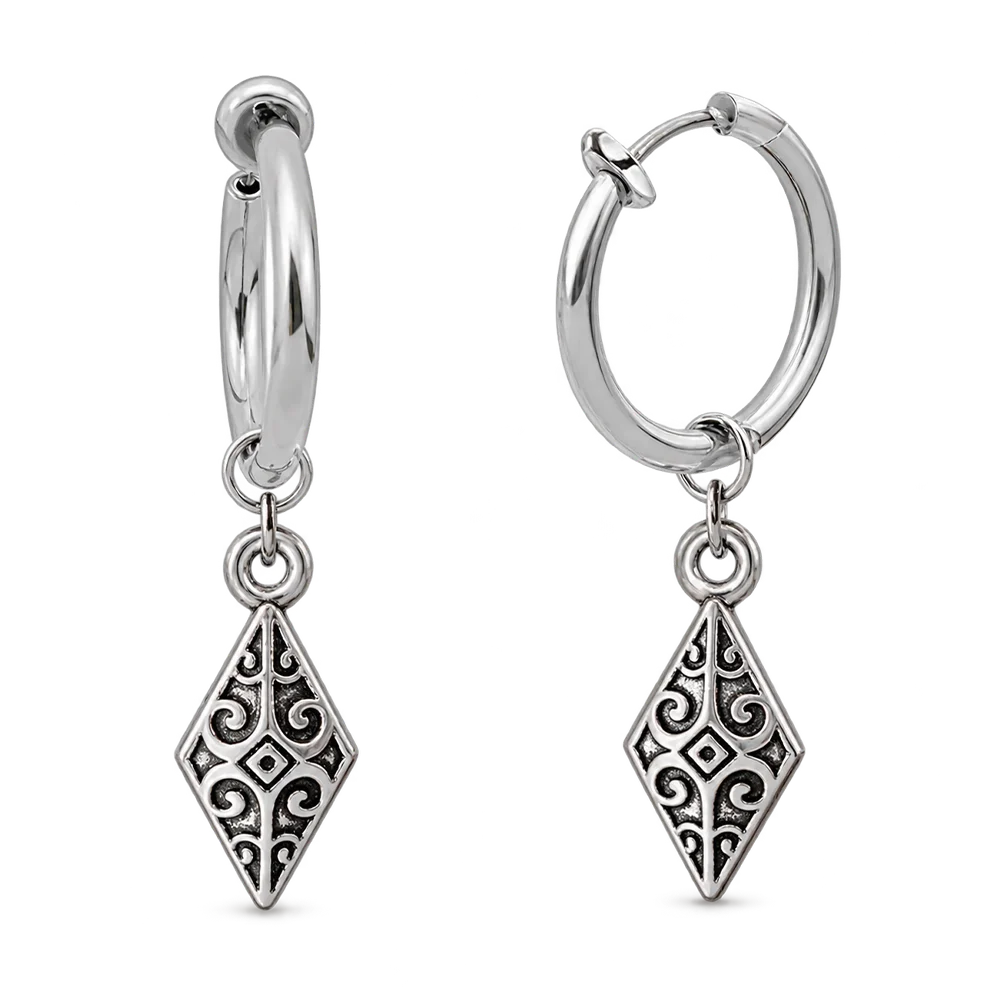 A pair of silver huggie hoop earrings with dangling ornate filigree diamond charms, shown on a clean white background.