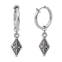 A pair of silver huggie hoop earrings with dangling ornate filigree diamond charms, shown on a clean white background.
