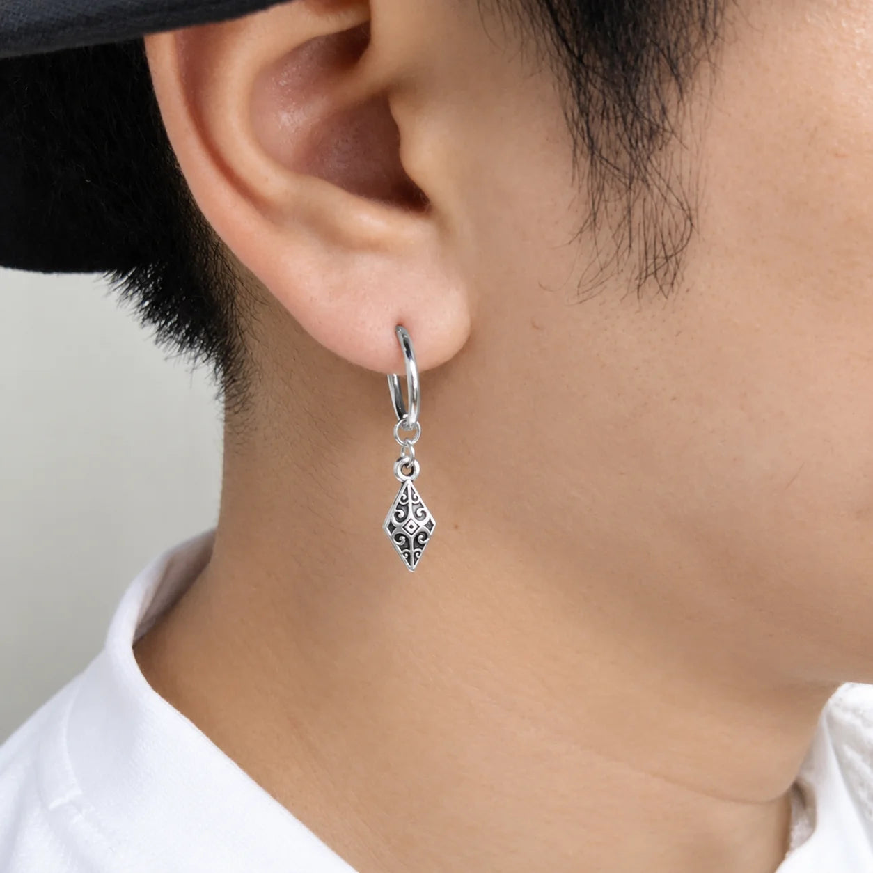 Vintage tribal drop clip-on earrings silver side view worn on ear filigree detail