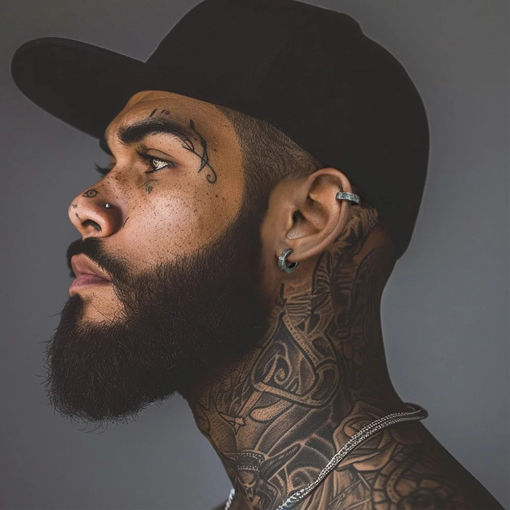 Silver tyre clip-on earrings side profile view on male model wearing black cowboy hat