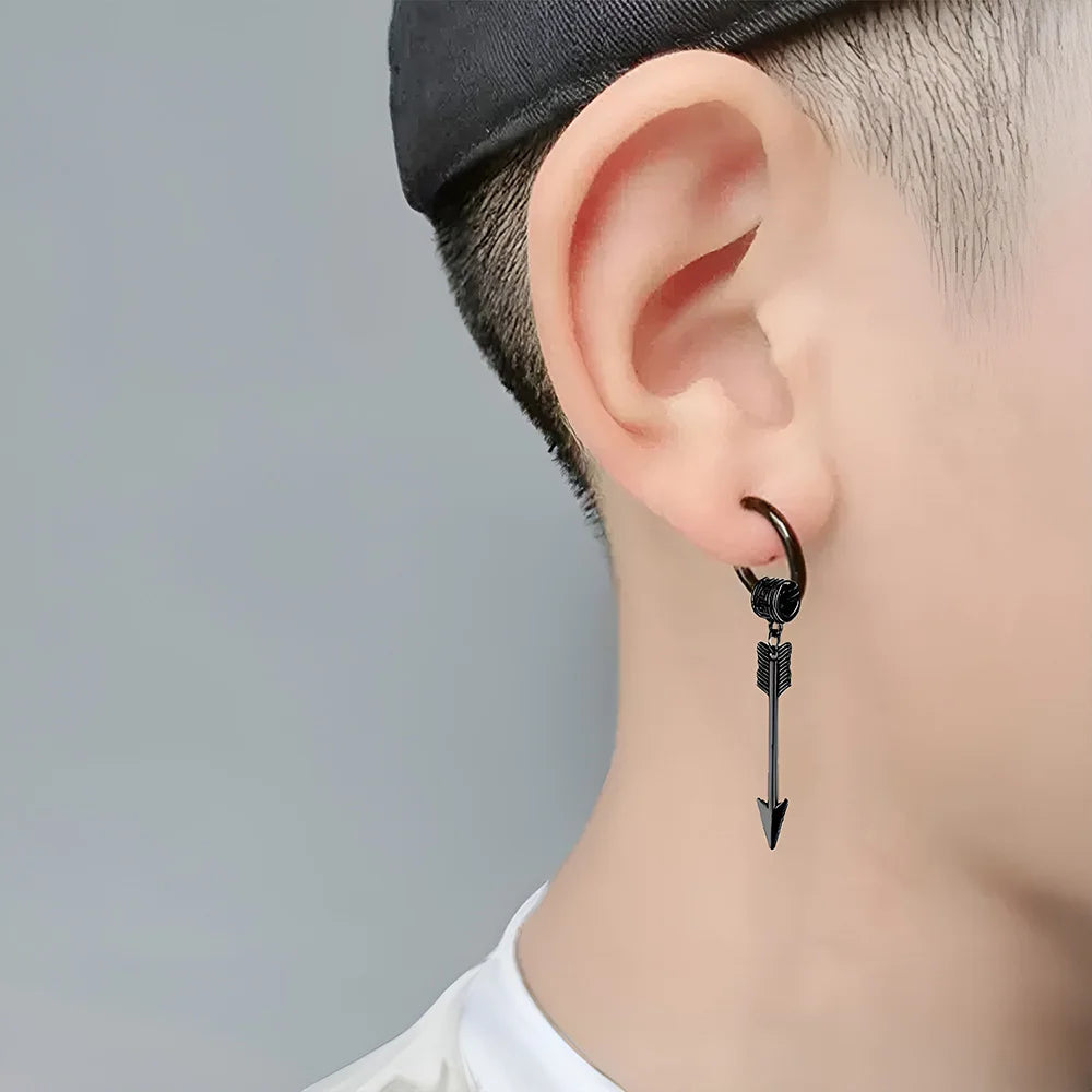 Black Warrior Arrow clip-on earrings side view worn on ear, featuring dangling arrow design with metal finish