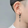 Black Warrior Arrow clip-on earrings side view worn on ear, featuring dangling arrow design with metal finish