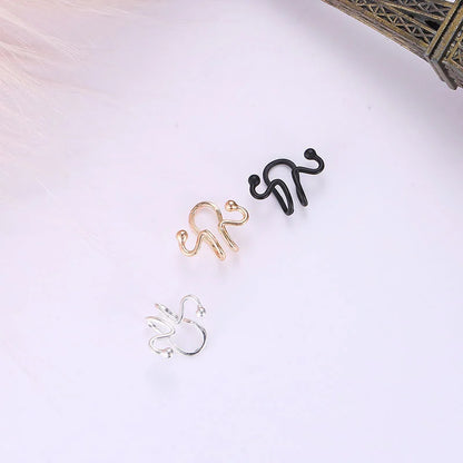 Silver Wavy Tragus Cuff next to gold and black options, emphasizing variety.