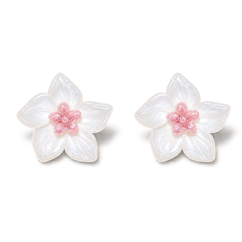 A pair of white flower-shaped magnetic stud earrings with textured petals and small pink centers, shown on a clean white background.
