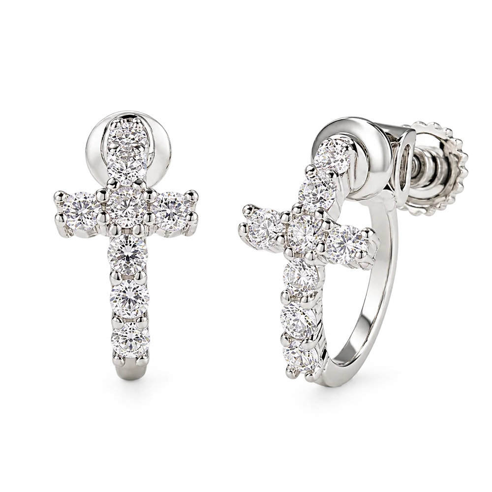 A pair of silver-toned hoop earrings with cross-shaped front embellishments, both covered in clear round-cut stones, shown on a plain white background.
