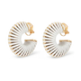 Pair of white leather wrapped clip-on hoop earrings on fabric