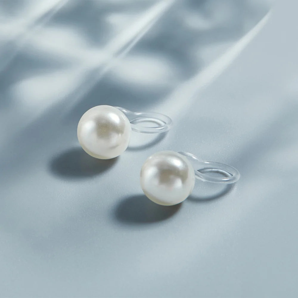 Lightweight White Pearl Clip-On Earrings for women, featuring a transparent clip for a seamless appearance.