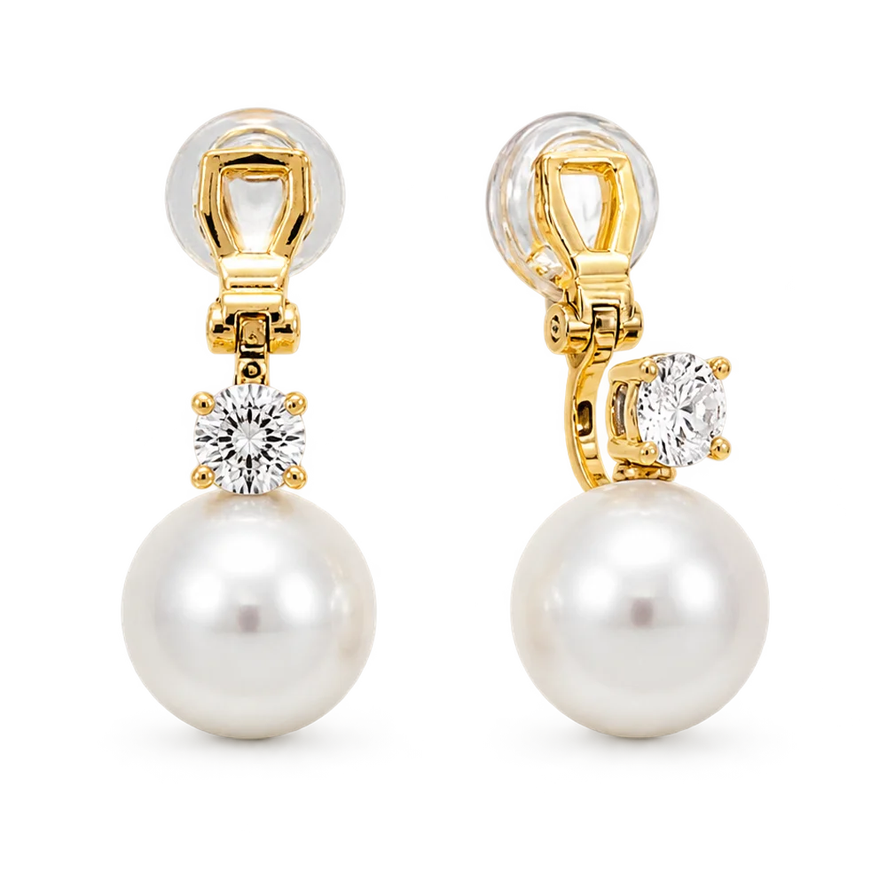 A pair of gold and pearl drop earrings with clear gemstones, shown on a plain white background.