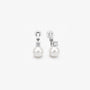 Pair of White Pearl Drop Clip-On Earrings in Silver Setting displayed, capturing the elegant design and color contrast.