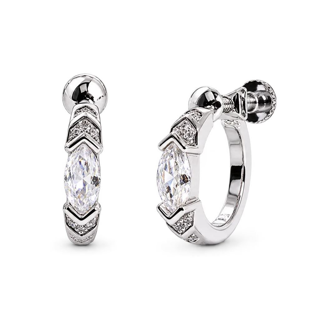 A pair of silver huggie hoop earrings with marquise-cut clear gemstones and small pavé-set accent stones, shown on a clean white background.