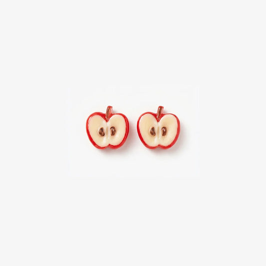 Pair of realistic 3D apple slice magnetic clip-on earrings with red skin and white flesh on a clean background.
