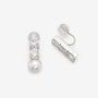 Asymmetrical CZ and pearl clip-on earrings showing the open C-Type clip and clear resin pad