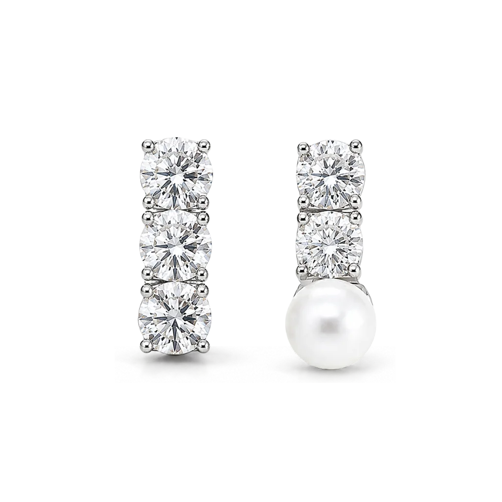 Asymmetrical clip-on earrings: a three-stone cubic zirconia bar and a two-stone CZ bar with a shell pearl drop