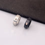 The black and silver versions of the unisex zircon clip-on hoop earrings shown side-by-side to compare the two color options.