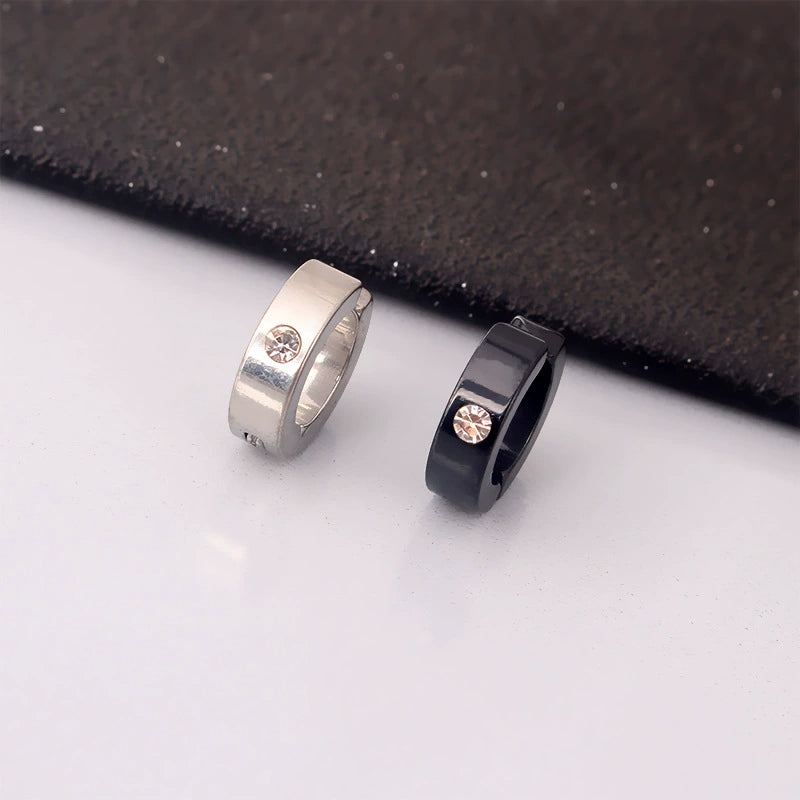 The black and silver versions of the unisex zircon clip-on hoop earrings shown side-by-side to compare the two color options.