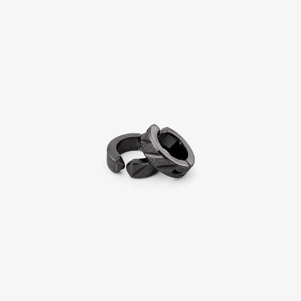 Black clip on huggie hoop earrings showing the open hinged closure