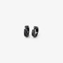 Close up detail of the diagonal faceted texture on black clip on huggie hoop earrings