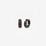 Pair of black faceted clip on huggie hoop earrings shown from the front