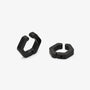 A pair of glossy black hexagonal hoop earrings shown on a white background.