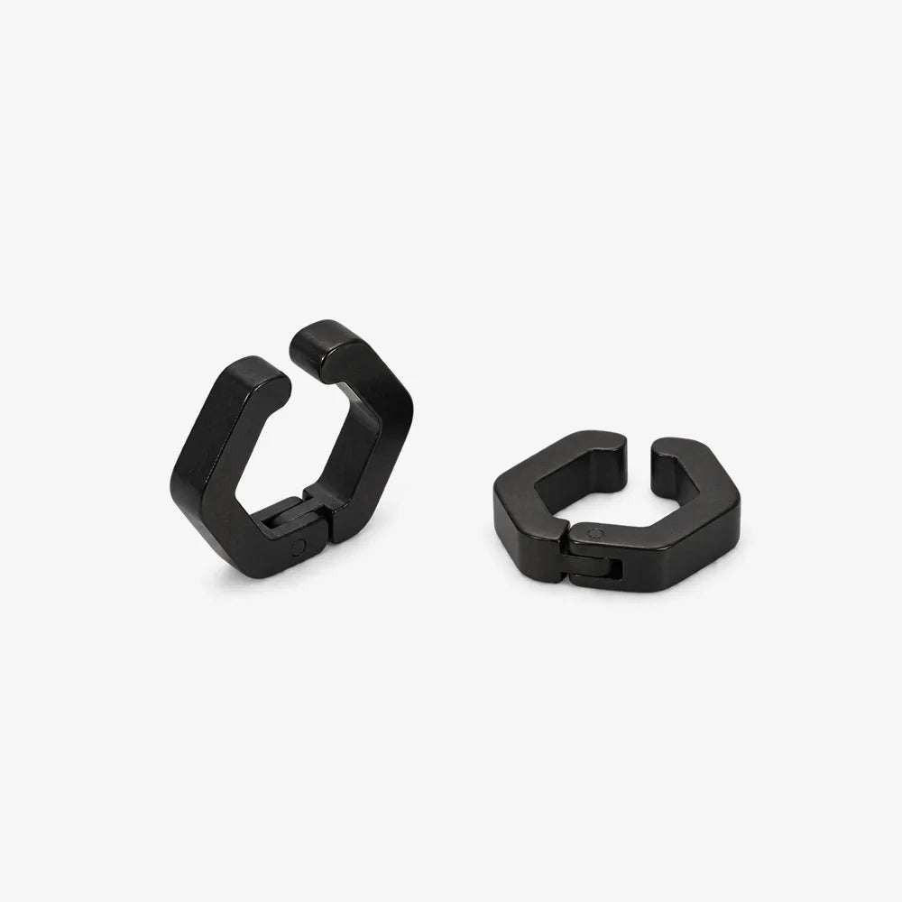 A pair of glossy black hexagonal hoop earrings shown on a white background.