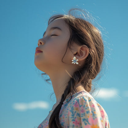 Add a touch of playful charm to your child's wardrobe with our mismatched blue and ivory flower earrings. No piercings needed—just clip and go!