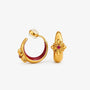 A pair of 16k gold-finished cross motif clip-on hoops with a deep crimson enamel lining and central stone.