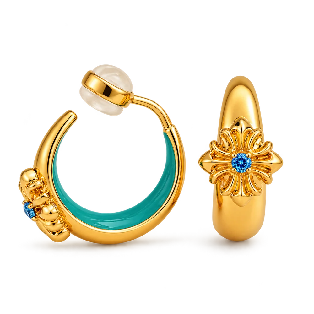 A pair of gold hoop earrings shown on a clean white background. One earring is open and displays a curved gold body with a turquoise enamel inlay and a small blue gemstone.