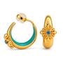 A pair of gold hoop earrings shown on a clean white background. One earring is open and displays a curved gold body with a turquoise enamel inlay and a small blue gemstone.