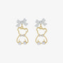Gold bow-tied bear pearl clip-on earrings front view with white bows and pearl details on white background