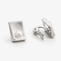Brushed rectangle pearl clip-on earrings showing the adjustable hinged clip from the back