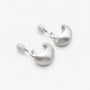 Back view of brushed dome clip-on earrings showing the adjustable hinged clip