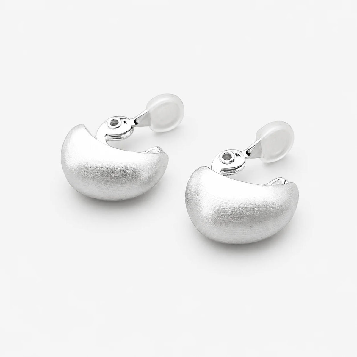 Pair of satin-brushed dome clip-on earrings with adjustable hinged clips and clear pads